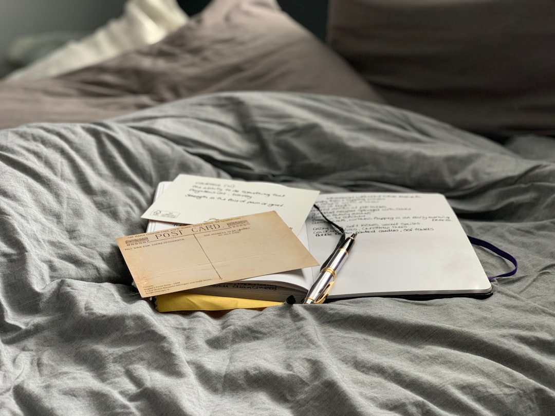 Open journal and pen used to record personal gout triggers and symptom patterns.