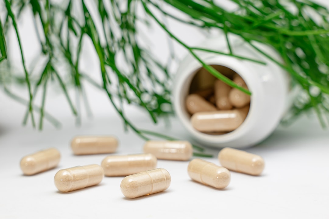 Supplement bottles and capsules arranged on a clean surface.